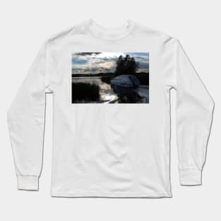 A boat travelling the Norfolk Broads near dusk Long Sleeve T-Shirt